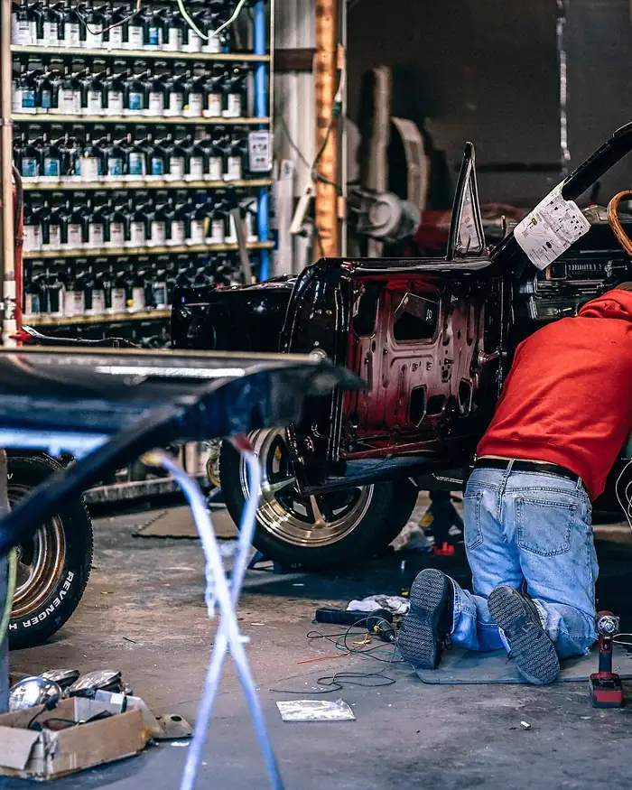 A mechanic working on a car in a workshop